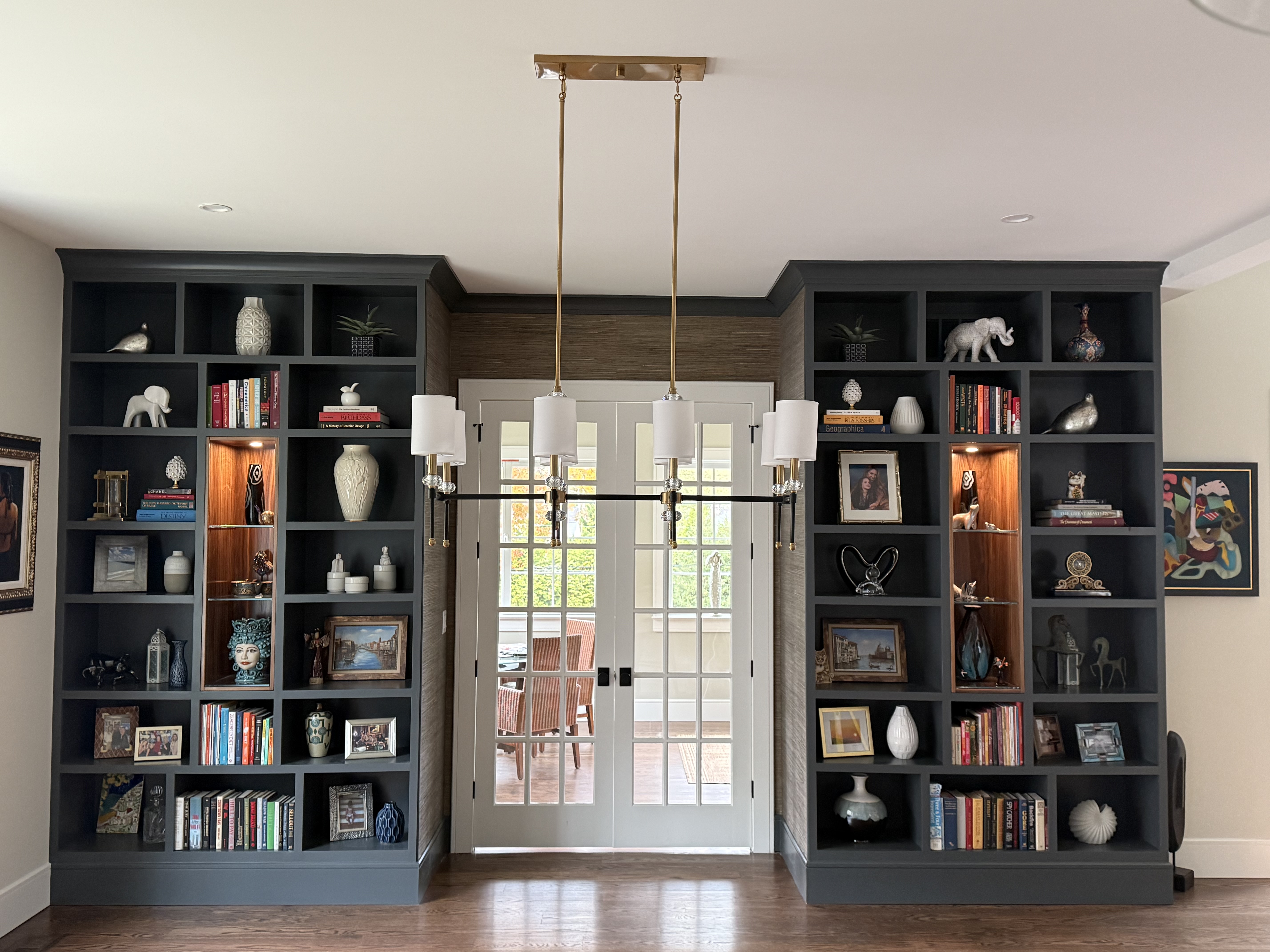 Completed dark painted built-in bookcases by Delaware Renovation